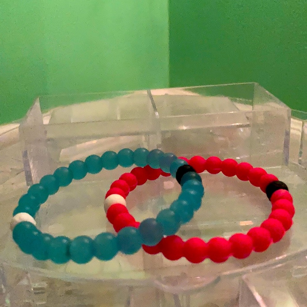 Blue and pink Lokai bracelets